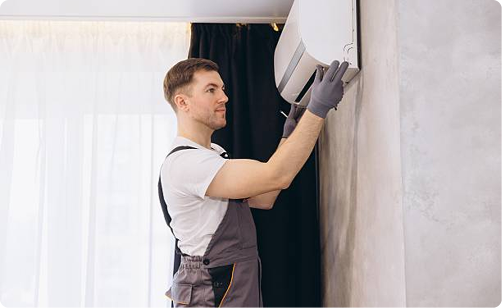 HVAC professional working on air conditioner